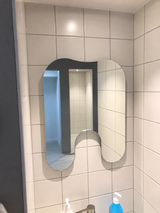 Tandformad spegel
