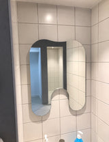 Tandformad spegel